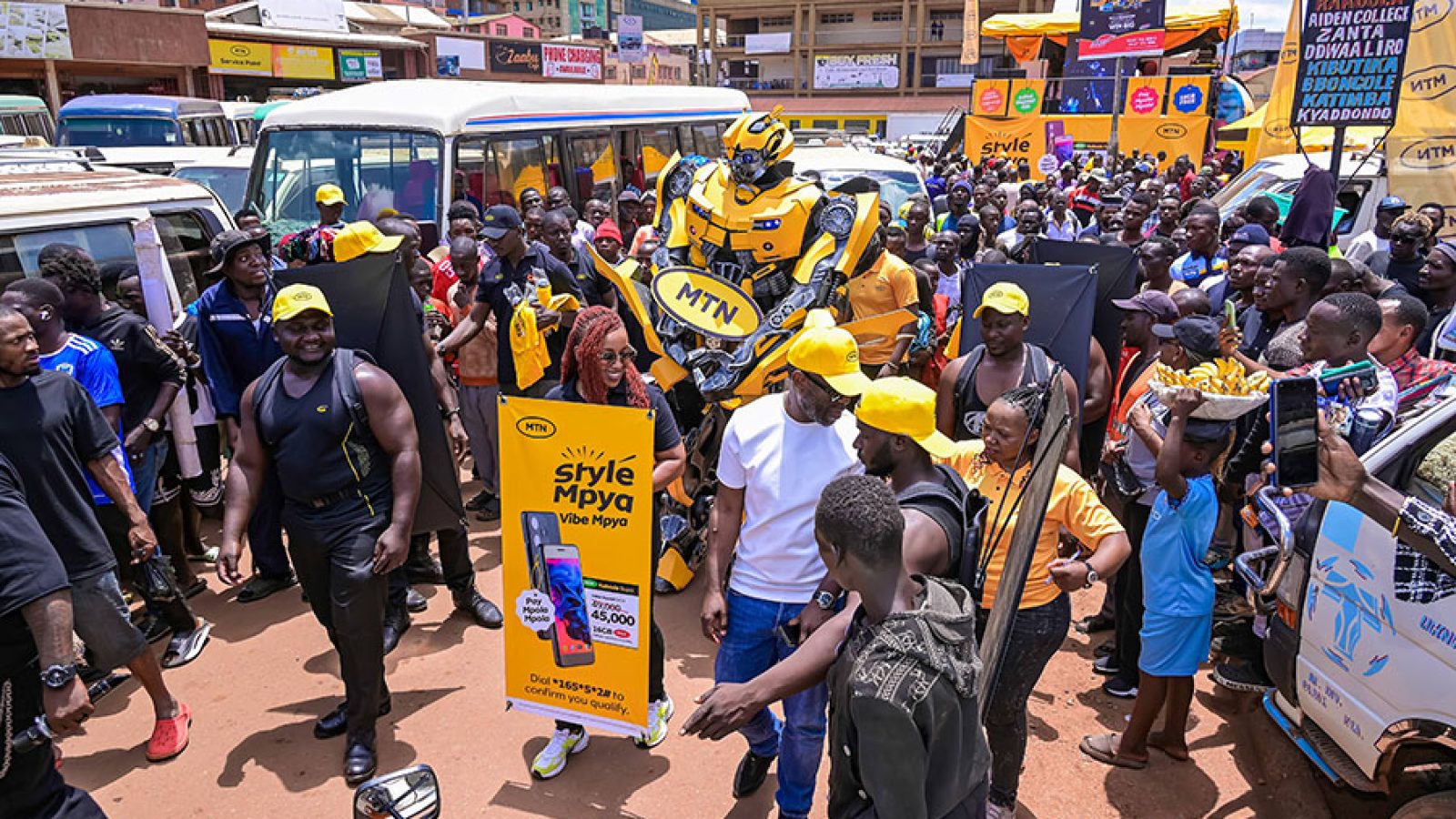 The-MTN-Ugandas-Chief-Executive-Officer-Sylvia-Mulinge-walking-around-the-New-Taxi-Park-engaging-with-travellers-at-the-launch-of-Kabode-Supa-smartphone